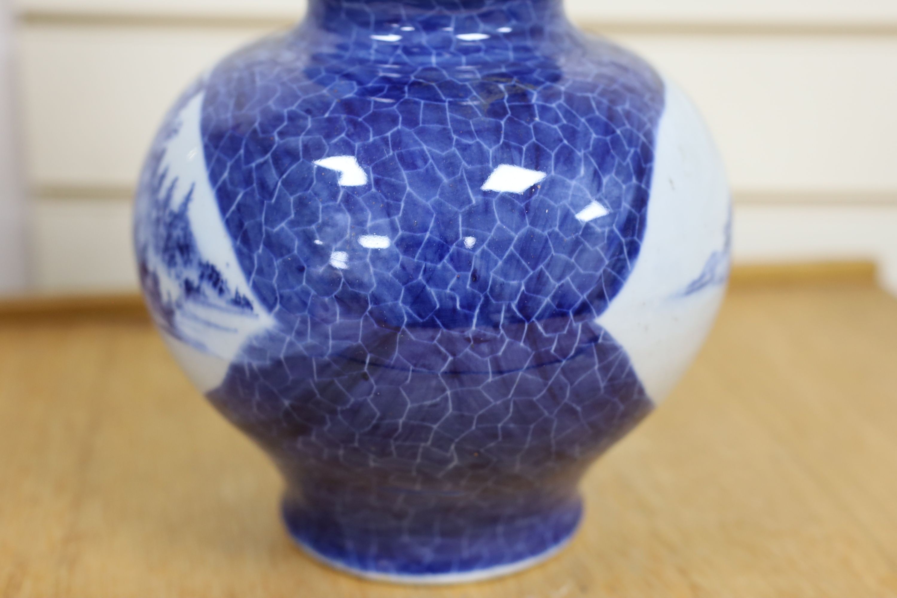 A Chinese blue and white gourd vase with landscape decoration, a similar blue and white sleeve vase and a Japanese Kutani vase